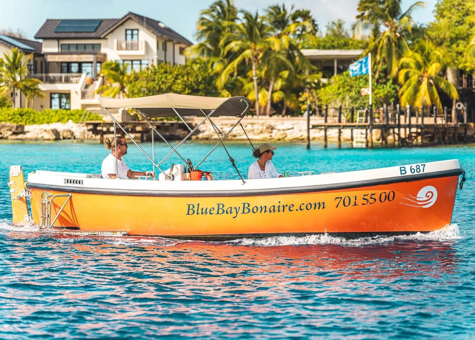 Orange Dutch Sloop on the water of Bonaire, photo 1 of 9