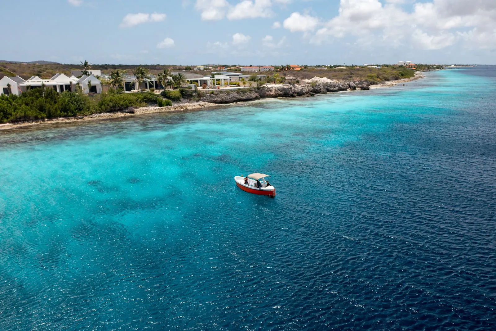 Orange Dutch Sloop on the water of Bonaire, photo 4 of 9
