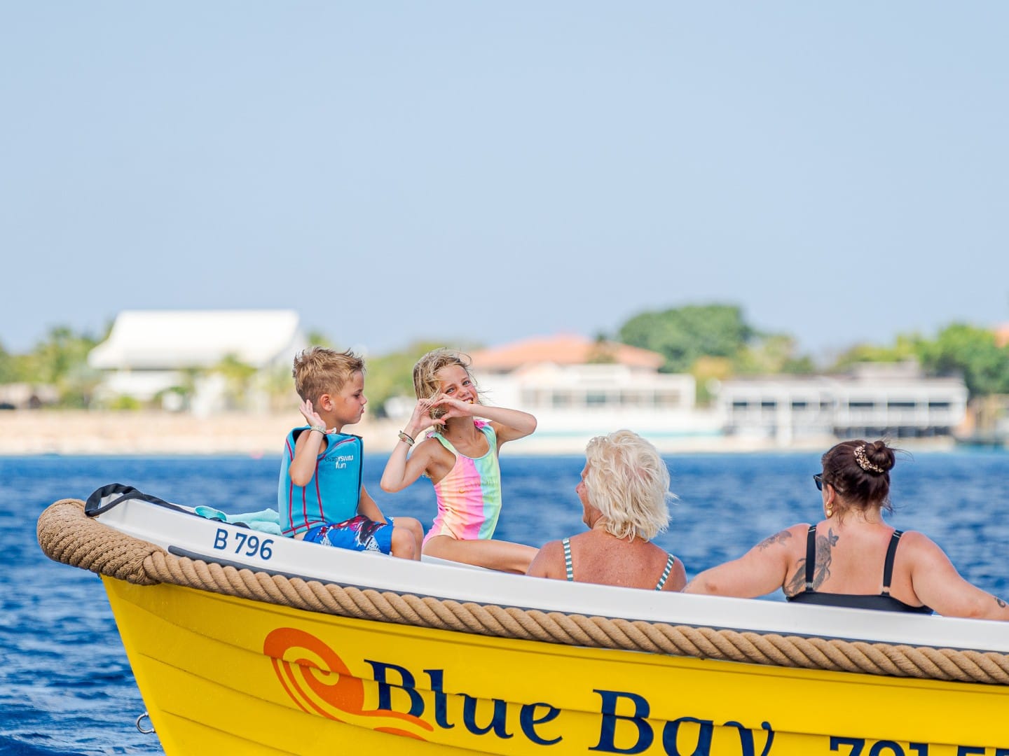 Children on a yellow rental boat from Bonaire Boat Rentals